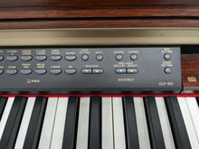 Load image into Gallery viewer, Yamaha Clavinova CLP-150 digital piano and stool in mahogany stock #24409