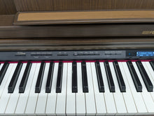 Load image into Gallery viewer, Roland LX-7 Luxury Digital Piano and stool in brown walnut finish Stock nr 24416