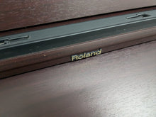 Load image into Gallery viewer, Roland HP103e digital piano in mahogany finish stock number 24431
