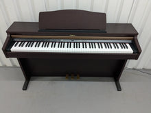 Load image into Gallery viewer, Roland HP103e digital piano in mahogany finish stock number 24431