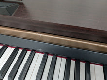 Load image into Gallery viewer, Roland HP103e digital piano in mahogany finish stock number 24431