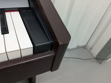 Load image into Gallery viewer, Roland HP103e digital piano in mahogany finish stock number 24431