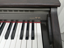 Load image into Gallery viewer, Casio Celviano AP-45 Digital Piano in dark rosewood finish, hammer action stock # 24429