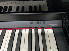 Load image into Gallery viewer, Roland HP506 Digital Piano glossy black wooden action keys + stool Stock nr 24443