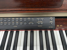 Load image into Gallery viewer, Yamaha Clavinova CLP-150 digital piano and stool in mahogany stock #24447