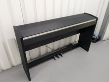 Load image into Gallery viewer, Roland F110 compact slim size Digital Piano in black stock # 24479