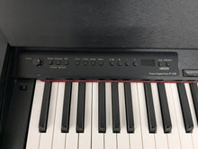 Load image into Gallery viewer, Roland F110 compact slim size Digital Piano in black stock # 24479