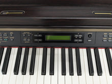 Load image into Gallery viewer, YAMAHA CLAVINOVA CLP-270 DIGITAL PIANO AND STOOL IN DARK ROSEWOOD stock nr 24510