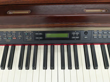 Load image into Gallery viewer, Yamaha Clavinova CLP-150 digital piano and stool in mahogany stock #24519