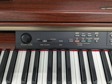 Load image into Gallery viewer, YAMAHA CLAVINOVA CLP-270 DIGITAL PIANO AND STOOL IN MAHOGANY FINISH stock #24538