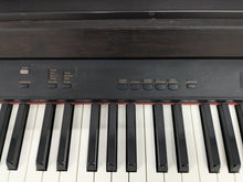 Load image into Gallery viewer, Yamaha Clavinova CLP-820 Digital Piano in dark rosewood stock nr 24585