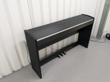Load image into Gallery viewer, Roland F110 compact slim size Digital Piano in black stock # 24580