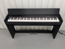 Load image into Gallery viewer, Roland F110 compact slim size Digital Piano in black stock # 24580