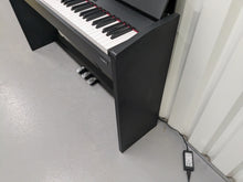 Load image into Gallery viewer, Roland F110 compact slim size Digital Piano in black stock # 24580