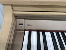 Load image into Gallery viewer, Roland HP102e digital piano and stool in light oak finish stock number 24617