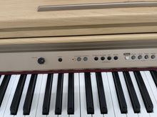 Load image into Gallery viewer, Roland HP102e digital piano and stool in light oak finish stock number 24617