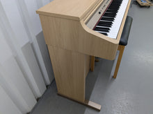 Load image into Gallery viewer, Roland HP102e digital piano and stool in light oak finish stock number 24617