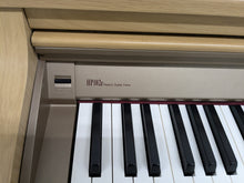 Load image into Gallery viewer, Roland HP102e digital piano and stool in light oak finish stock number 24614
