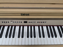 Load image into Gallery viewer, Roland HP102e digital piano and stool in light oak finish stock number 24614