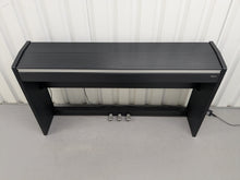 Load image into Gallery viewer, Roland F110 compact slim size Digital Piano in black stock # 24652