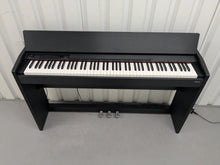 Load image into Gallery viewer, Roland F110 compact slim size Digital Piano in black stock # 24652