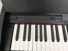 Load image into Gallery viewer, Roland F110 compact slim size Digital Piano in black stock # 24652