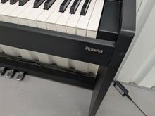 Load image into Gallery viewer, Roland F110 compact slim size Digital Piano in black stock # 24652