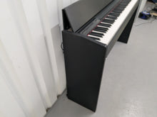 Load image into Gallery viewer, Roland F110 compact slim size Digital Piano in black stock # 24652