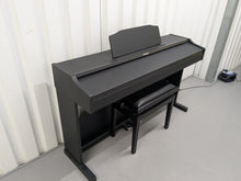 Load image into Gallery viewer, Roland RP102 digital piano and stool in satin black finish stock number 25008