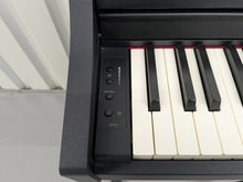 Load image into Gallery viewer, Roland RP102 digital piano and stool in satin black finish stock number 25008