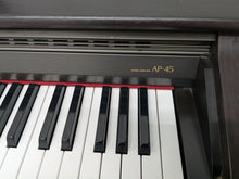 Load image into Gallery viewer, Casio Celviano AP-45 Digital Piano in dark rosewood finish, hammer action stock # 25022