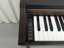 Load image into Gallery viewer, Roland HP101e Digital Piano in dark rosewood finish stock # 25037