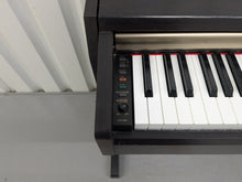 Load image into Gallery viewer, Yamaha Clavinova CLP-220 digital piano in dark rosewood stock #25024