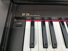 Load image into Gallery viewer, Roland HP330 digital piano in rosewood stock #25046
