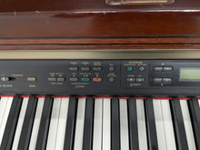 Load image into Gallery viewer, Yamaha Clavinova CLP-150 digital piano and stool in mahogany stock #25057