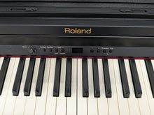 Load image into Gallery viewer, Roland RP301 digital piano in satin black finish stock number 25156