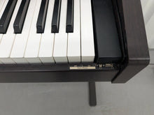 Load image into Gallery viewer, Roland RP101 Digital Piano in dark rosewood Stock # 2590