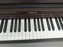 Load image into Gallery viewer, Roland RP101 Digital Piano in dark rosewood Stock # 2590