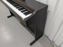 Load image into Gallery viewer, Roland RP101 Digital Piano in dark rosewood Stock # 2590