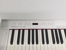 Load image into Gallery viewer, Roland F140R Digital Piano in satin white slim line space saver stock # 25230