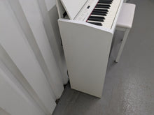 Load image into Gallery viewer, Roland F140R Digital Piano in satin white slim line space saver stock # 25230
