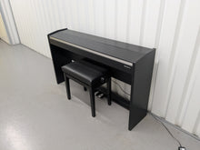 Load image into Gallery viewer, Roland F140R Digital Piano in satin black slim line space saver stock # 25253