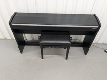 Load image into Gallery viewer, Roland F140R Digital Piano in satin black slim line space saver stock # 25253