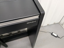 Load image into Gallery viewer, Roland F140R Digital Piano in satin black slim line space saver stock # 25253
