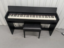 Load image into Gallery viewer, Roland F140R Digital Piano in satin black slim line space saver stock # 25253