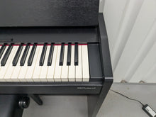 Load image into Gallery viewer, Roland F140R Digital Piano in satin black slim line space saver stock # 25253