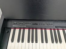 Load image into Gallery viewer, Roland F140R Digital Piano in satin black slim line space saver stock # 25253