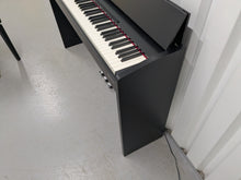 Load image into Gallery viewer, Roland F140R Digital Piano in satin black slim line space saver stock # 25253