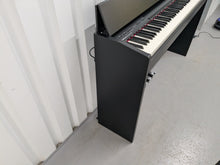 Load image into Gallery viewer, Roland F140R Digital Piano in satin black slim line space saver stock # 25253