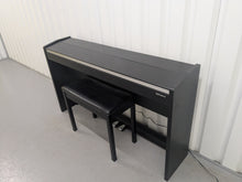 Load image into Gallery viewer, Roland F140R Digital Piano in satin black slim line space saver stock # 25303